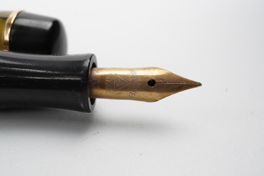 A Montblanc black and pearl fountain pen marked No.322 button filler